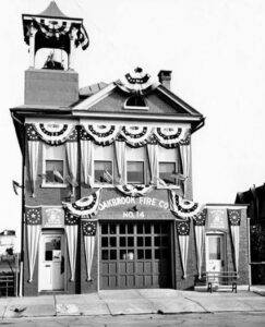 historical photo of a fire company building decorated for a holiday, protect historical architecture